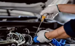 Mechanic checking engine oil thumbnail image